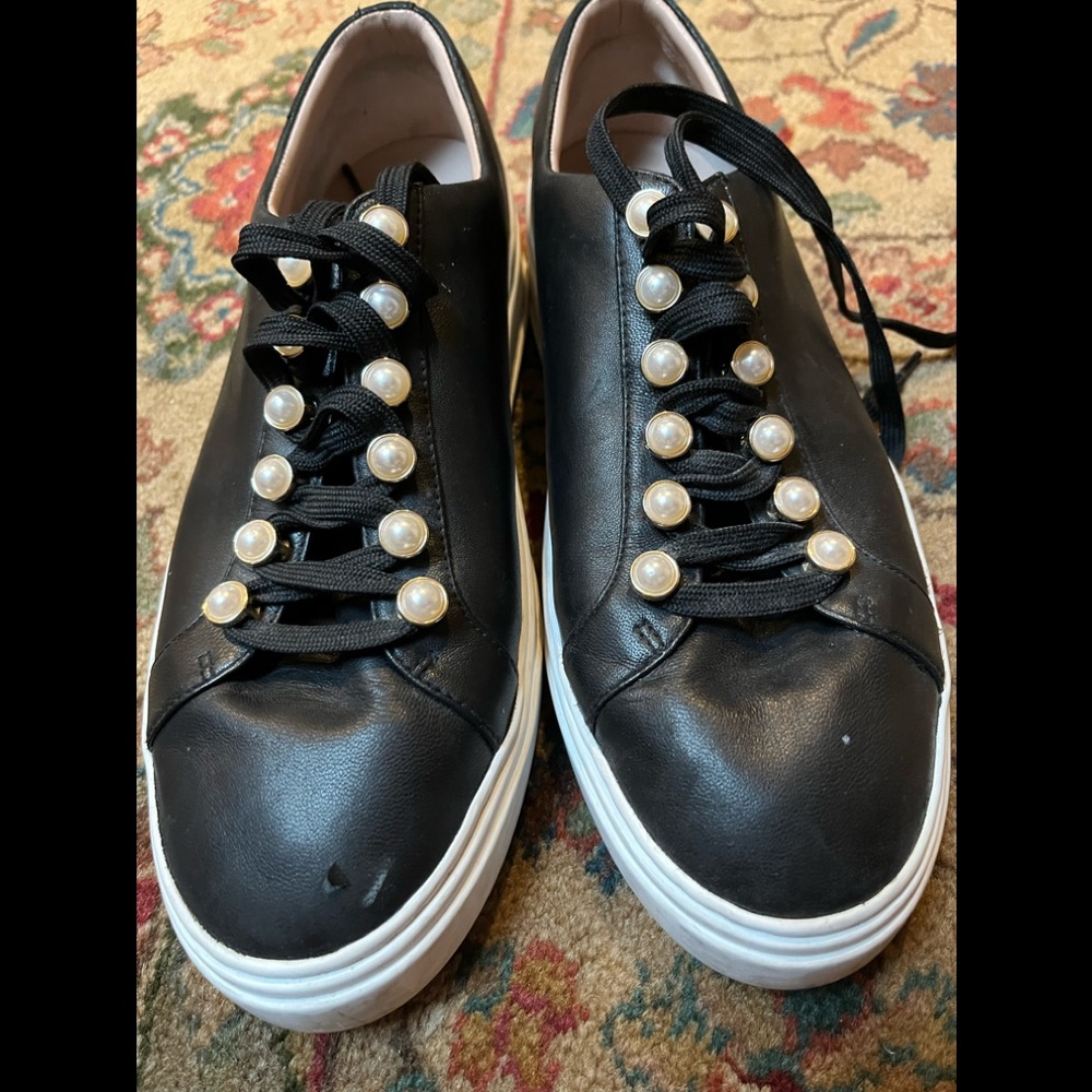 Black leather sneakers with pearl accent and ties up front